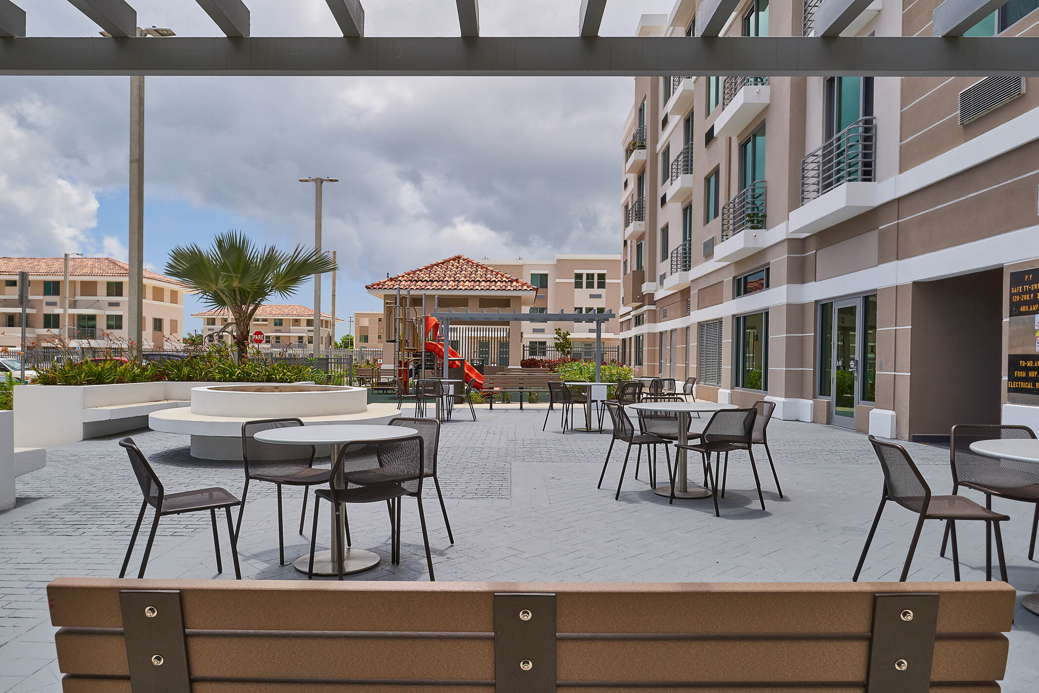 Outdoor patio with tables and chairs.